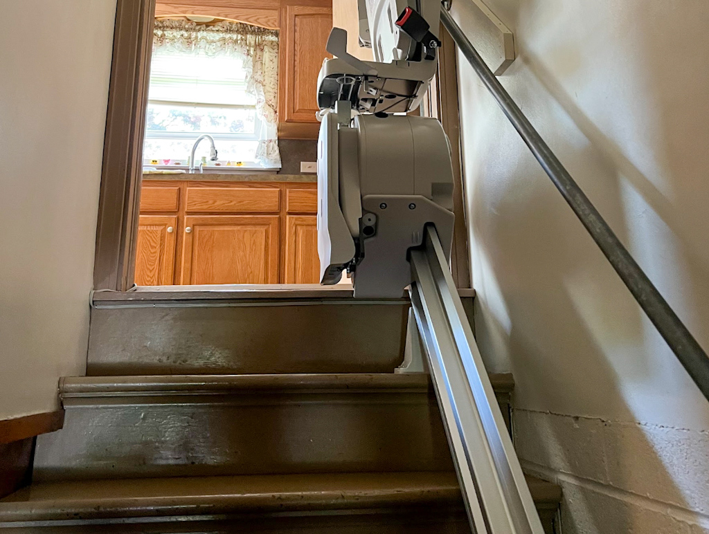 Photo of an installed stair lift resting at the top position in York, PA